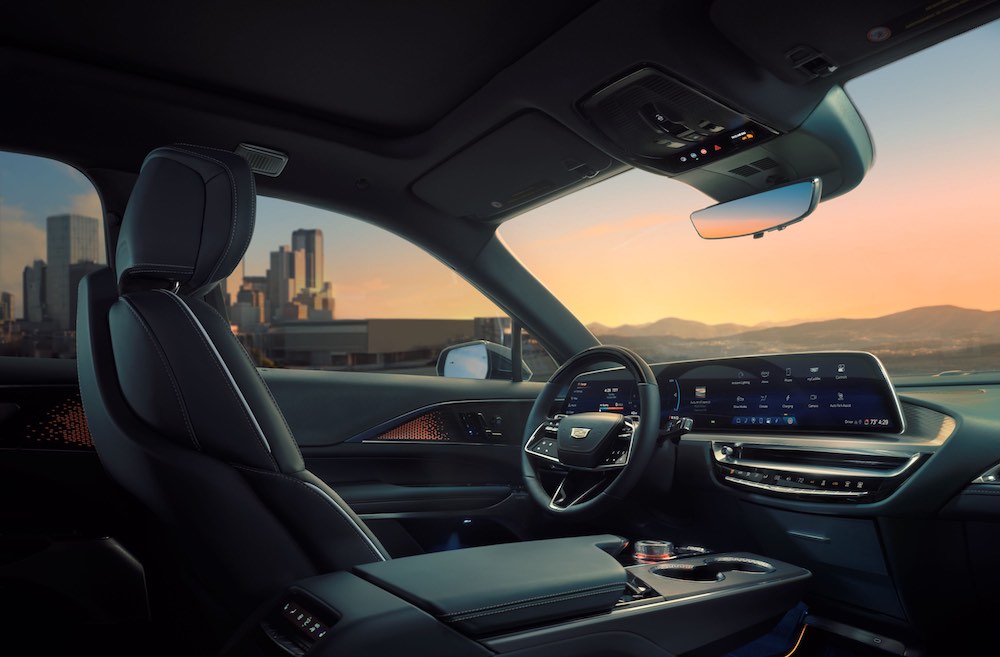 Interior view of the first row in the 2026 Cadillac LYRIQ. Juniper with Sky Cool Gray accents interior shown.